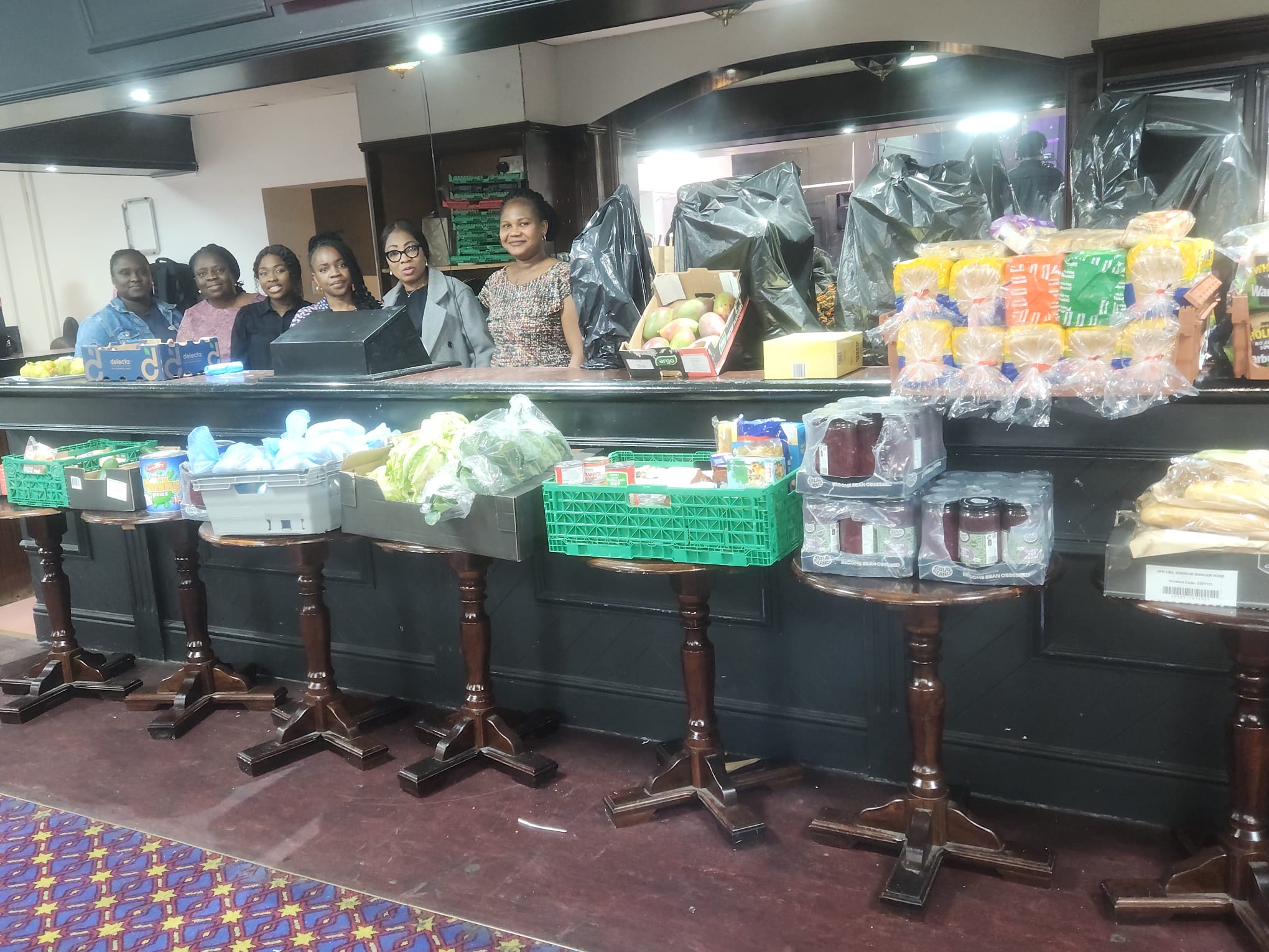 Food neatly displayed with volunteers