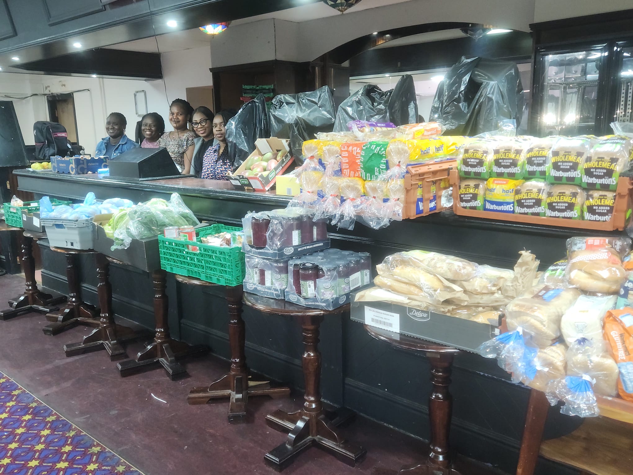 Food neatly displayed with volunteers