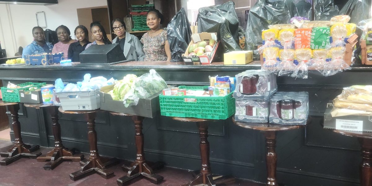 Food neatly displayed with volunteers
