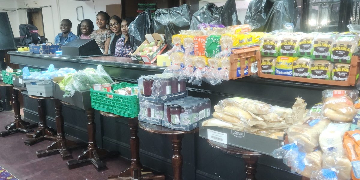 Food neatly displayed with volunteers